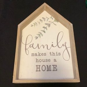“Family makes this a home” wall sign